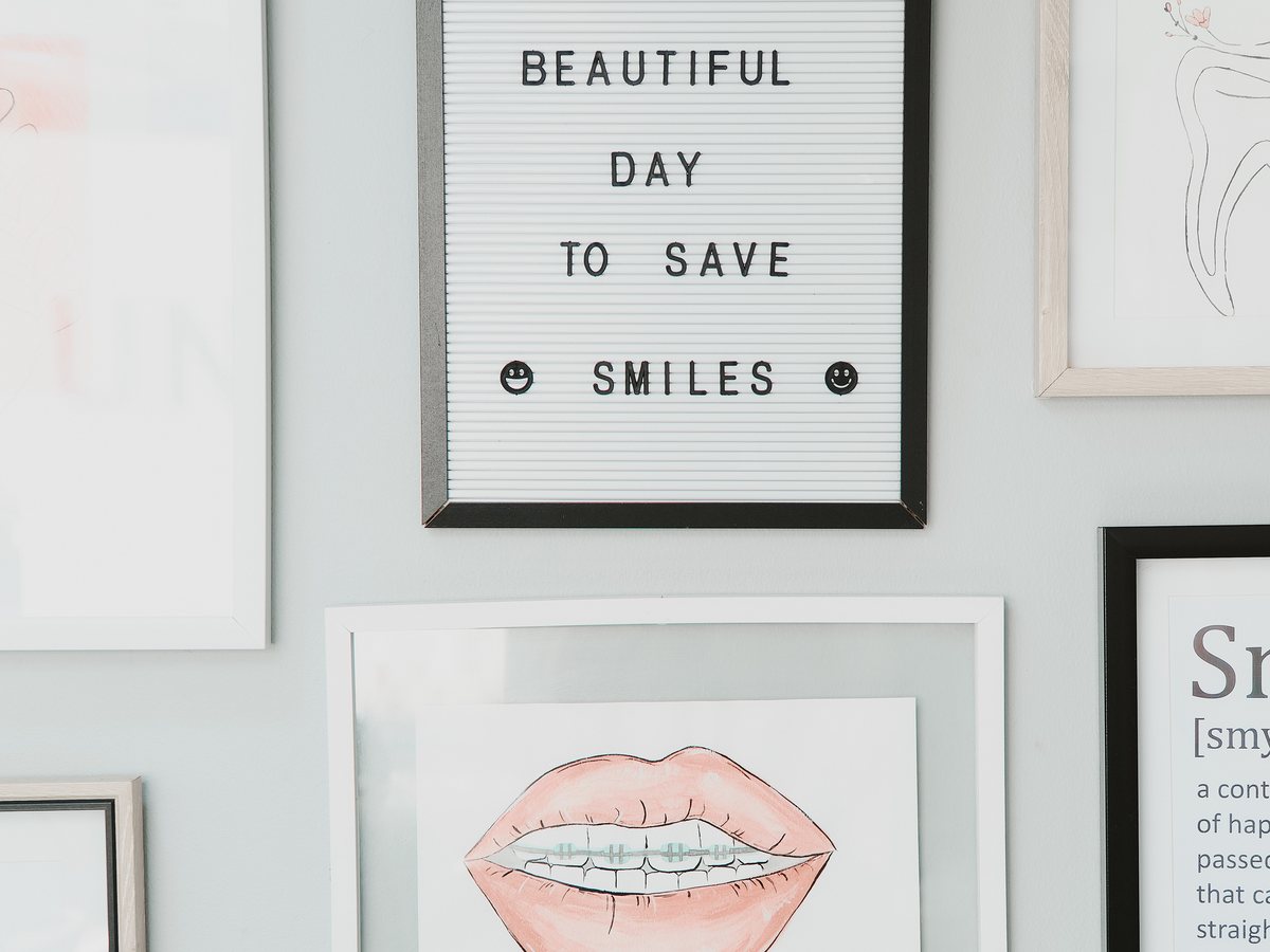 A sign at Hatfield Dental Studio reading 'It's a beautiful day to save smiles'